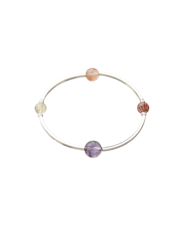 Elegant 4Play Bangle featuring four gemstones in sterling silver, showcasing natural beauty and unique designs.