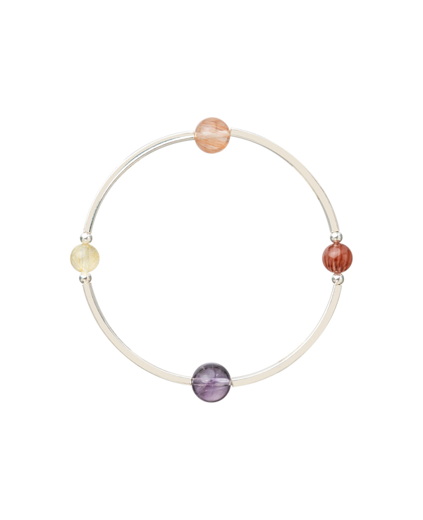 4Play Bangle showcasing four vibrant gemstones on a sterling silver band, harmonizing beauty and playfulness.