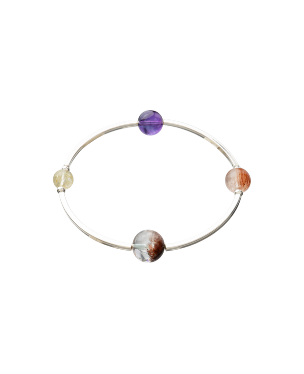 4Play Bangle featuring four colorful gemstones on a sterling silver band, showcasing unique natural beauty.