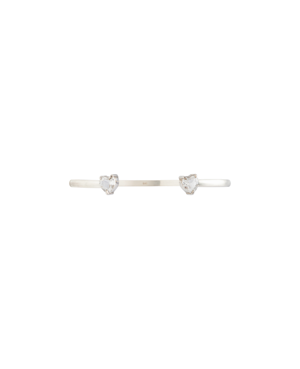 White Noise Echo Bangle featuring two heart-shaped rock crystals on a sleek sterling silver cuff.