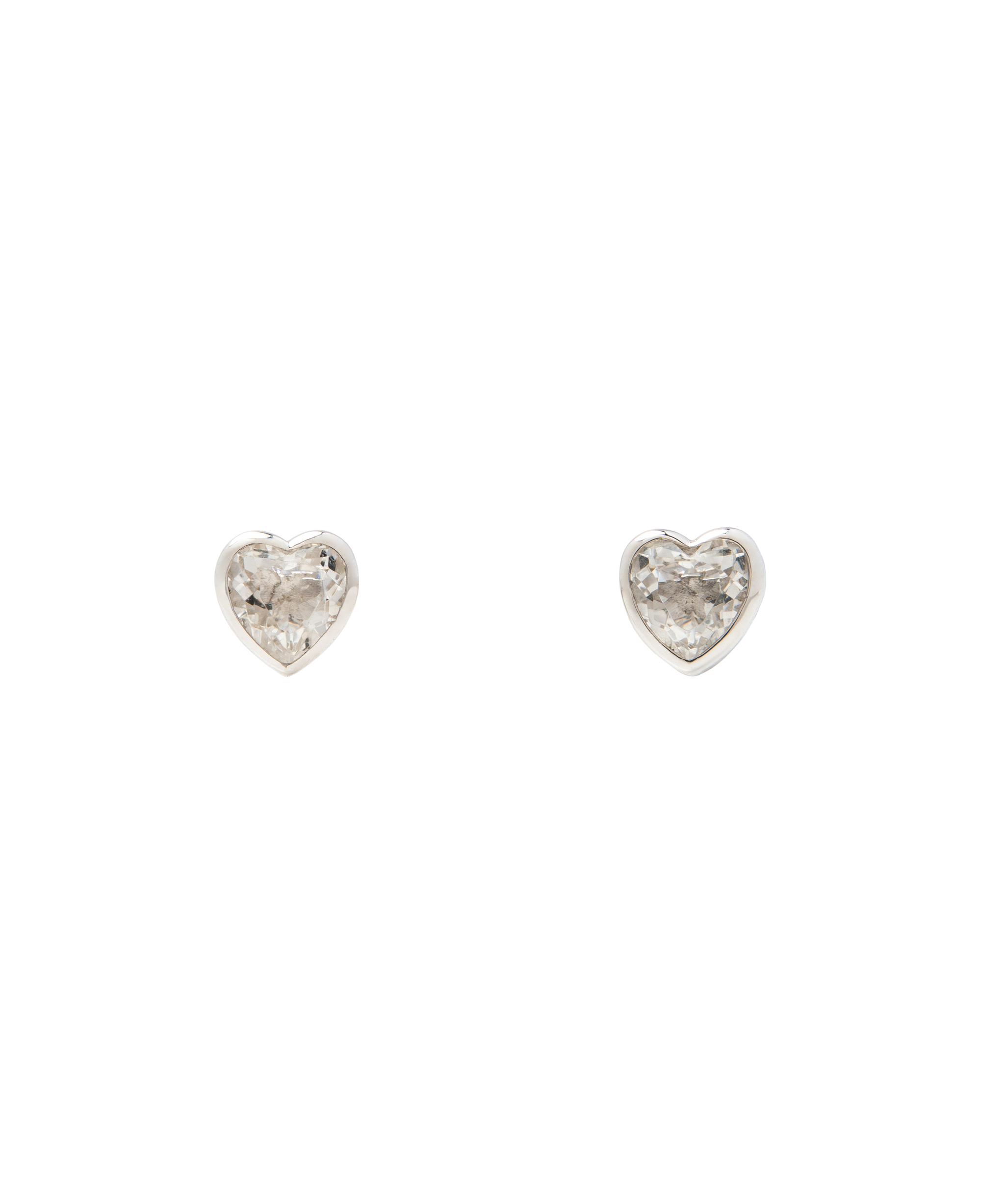 White Noise Frame Studs featuring heart-shaped rock crystals in sterling silver settings.