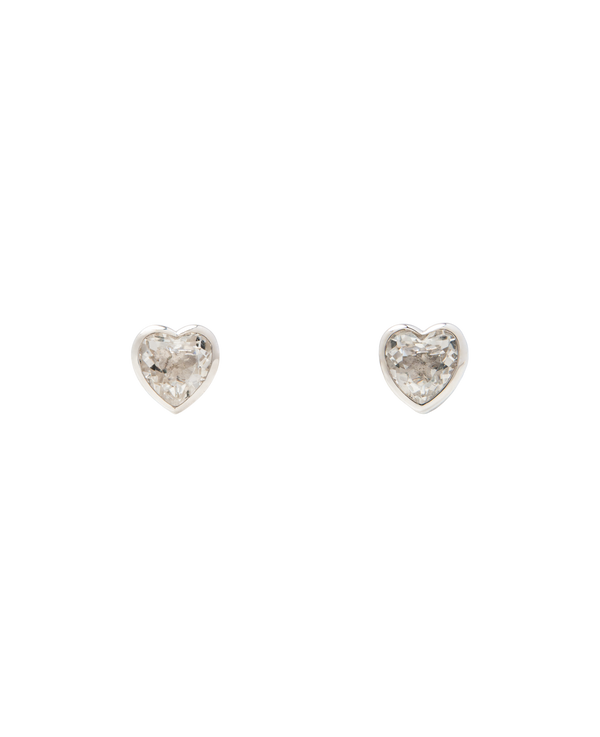 White Noise Frame Studs featuring heart-shaped rock crystals in sterling silver settings.