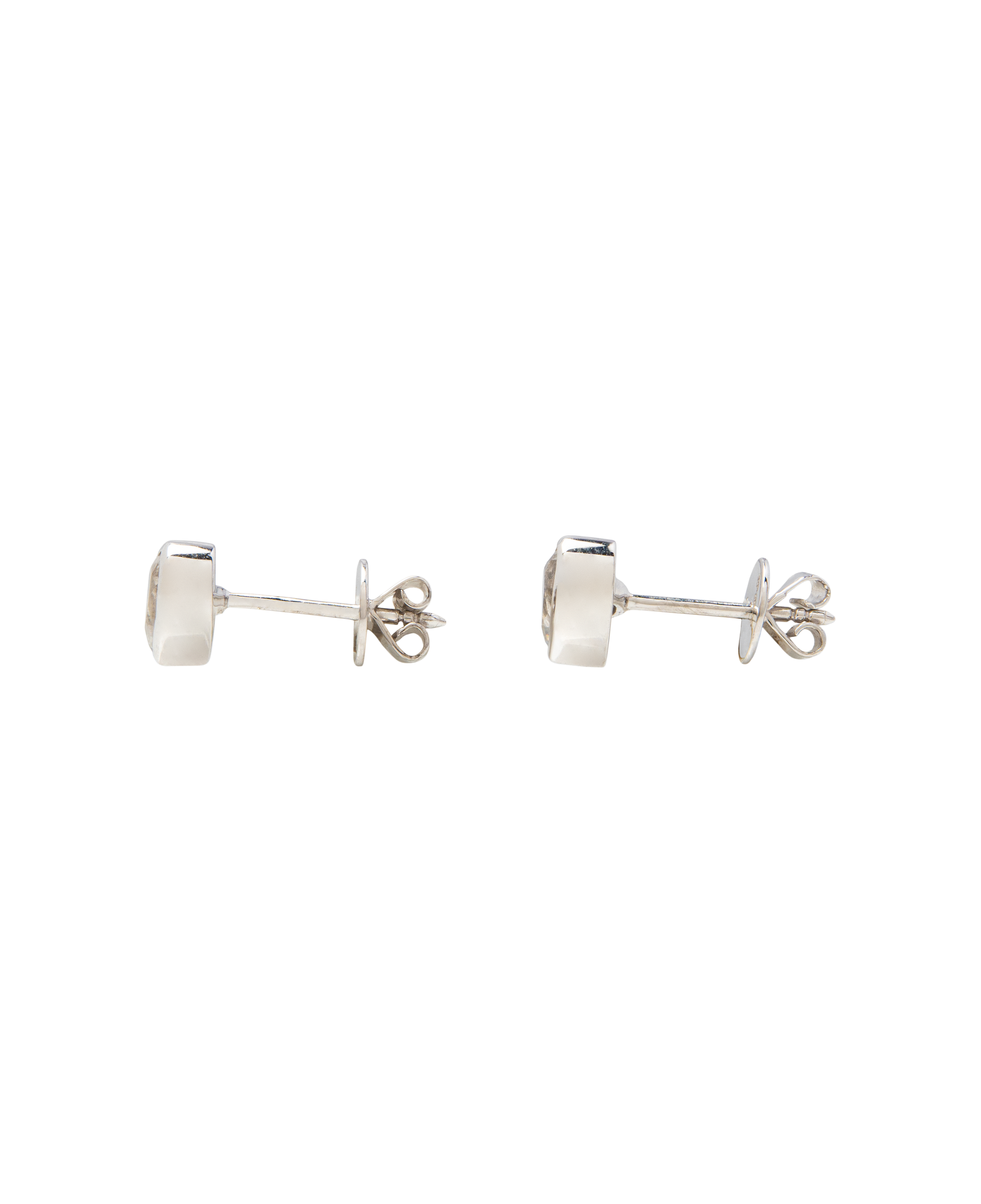 White Noise Frame Studs featuring a continuous sterling silver bezel and brilliant-cut rock crystal.