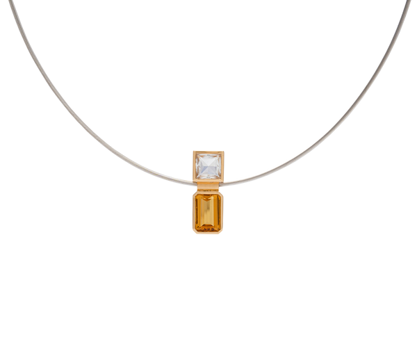 Elevé Yellow Emerald and Topaz pipe pendant with stainless steel chain, featuring 18k gold accents.