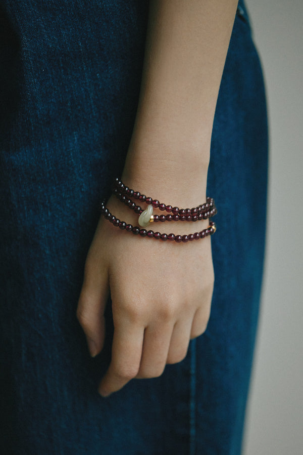 Model wearing garnet agarwood jade bracelet – 17cm