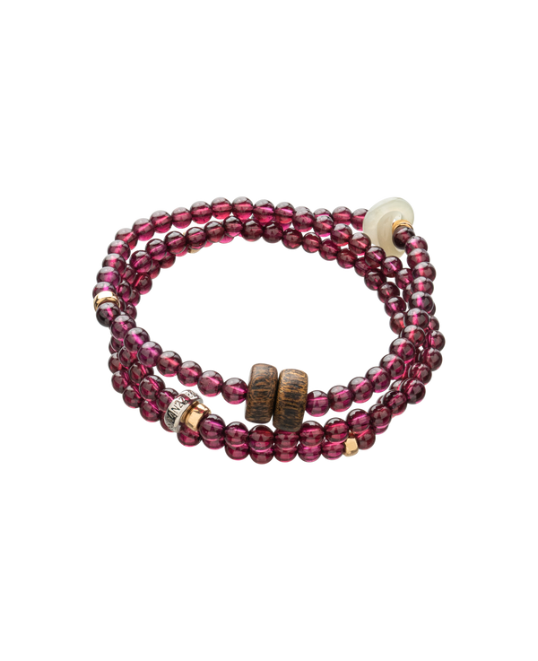 Triple wrap garnet agarwood jade bracelet on white background