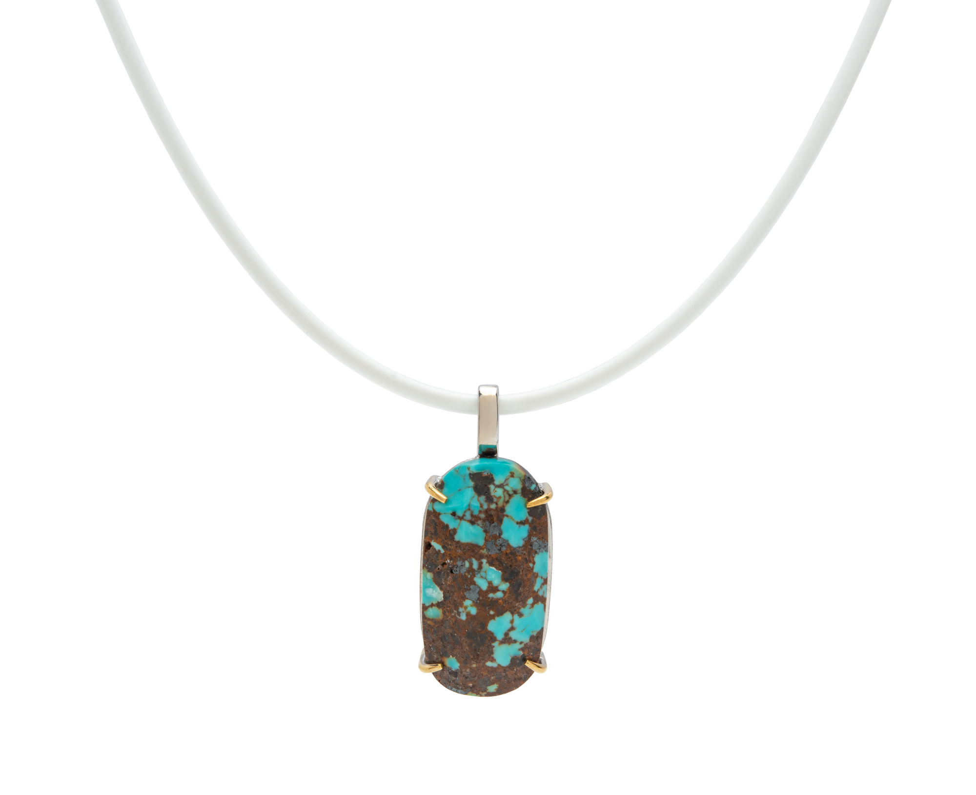 Handmade raw turquoise pendant with natural stone from Japan on a white cord, showcasing modern elegance and character.