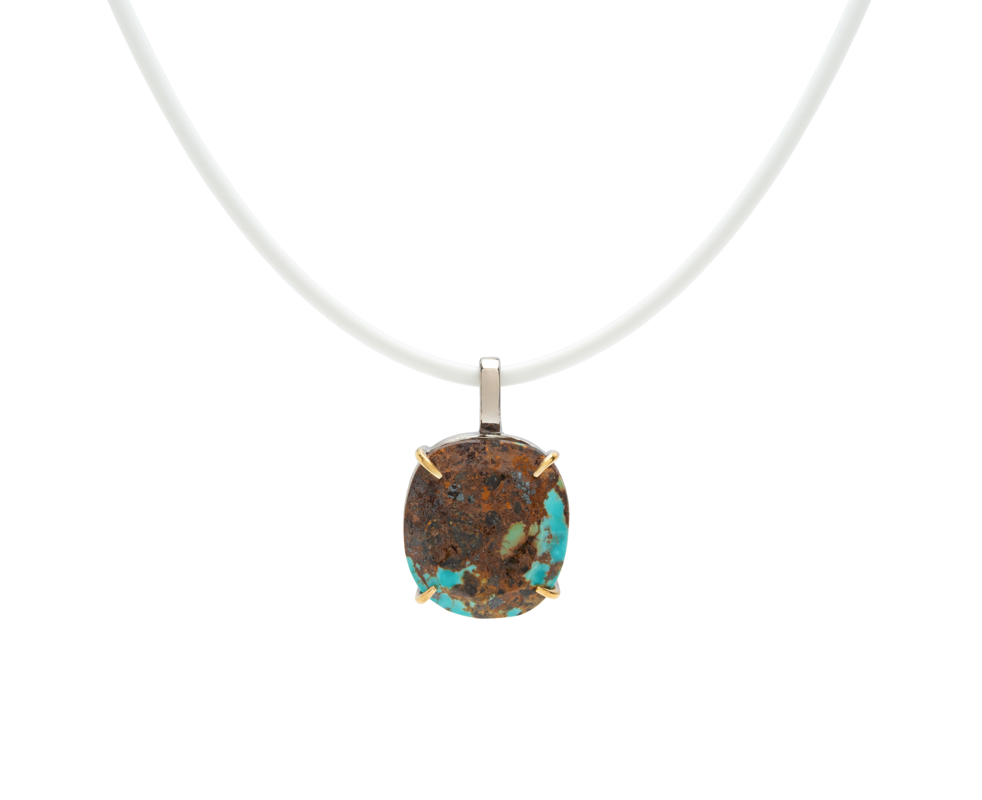 Turquoise handmade pendant necklace with raw turquoise stone on a white cord, showcasing unique natural beauty.