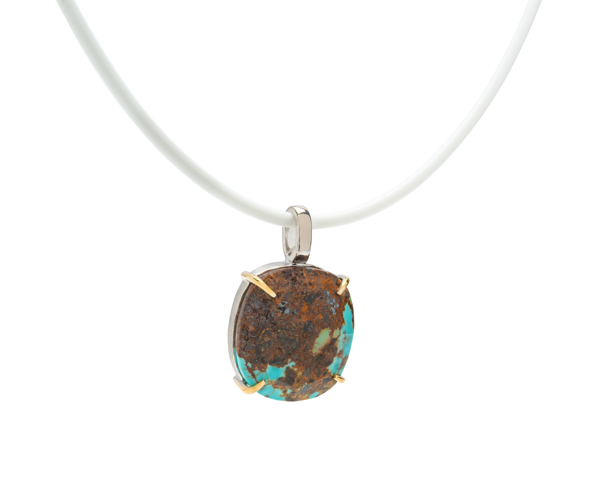 Turquoise handmade pendant necklace with raw turquoise stone on a white cord, showcasing unique natural beauty.