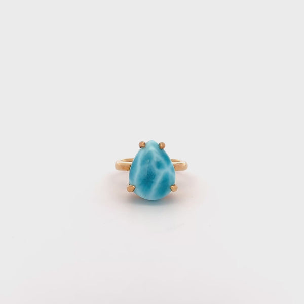 Larimar Exclusive Claw Ring with vibrant blue stone in 18K gold claws