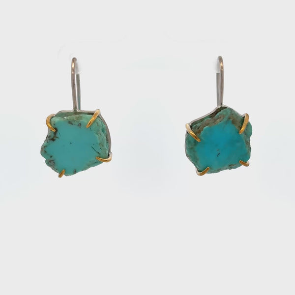 Raw turquoise handmade ear hook earrings with claw settings showcasing organic beauty and minimalist design.