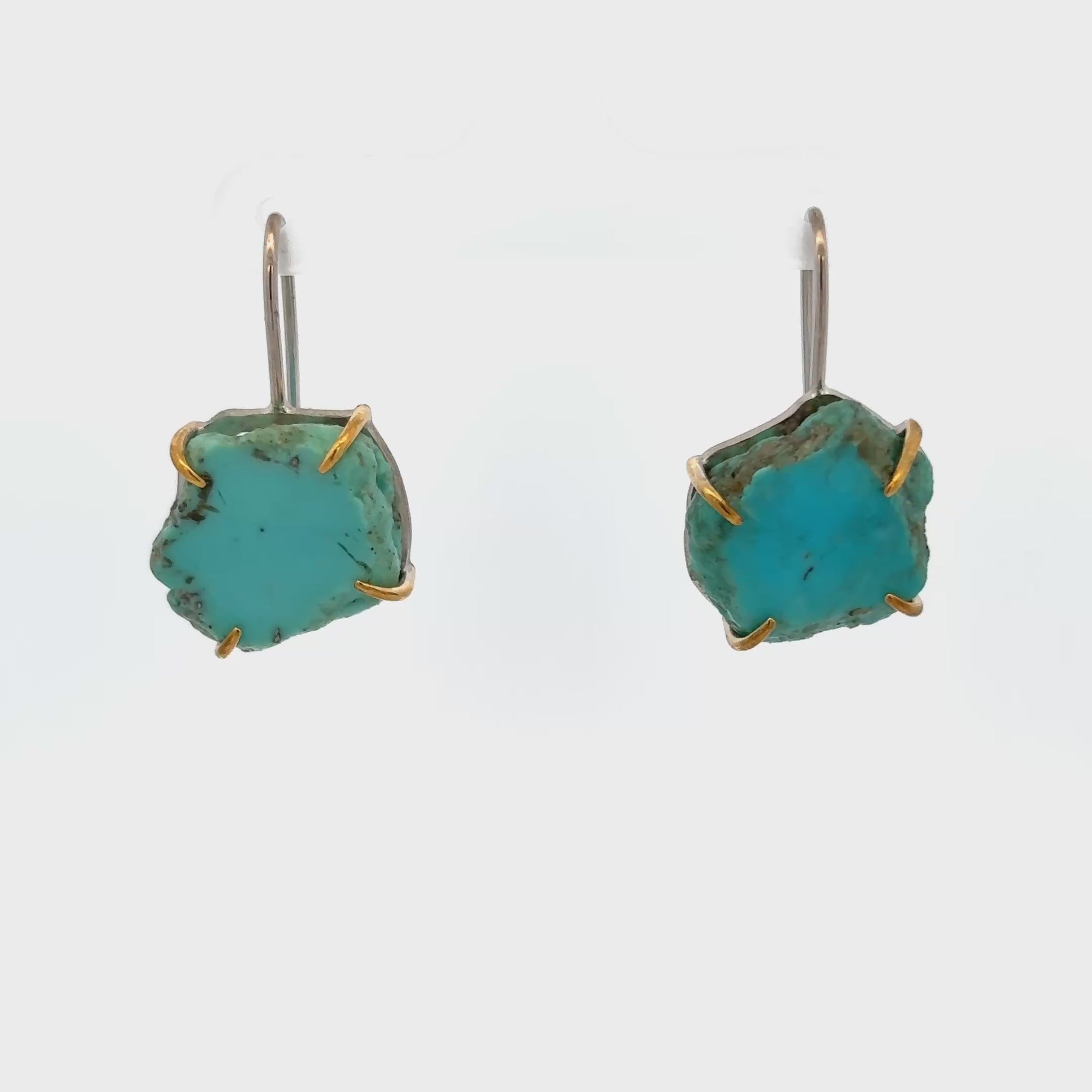 Raw turquoise handmade ear hook earrings with claw settings showcasing organic beauty and minimalist design.